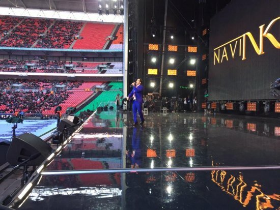 Narendra Modi UK visit 2015: Pics of electric atmosphere at Wembley Stadium for 'UKWelcomesModi' community reception Artist Navin Kundra performs at Wembley Stadium for Modi's welcome reception